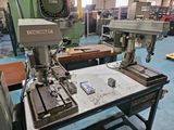 two machines that are sitting on a table in a room