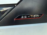 a close up of a car ' s emblem on the side of the car