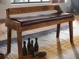 un banc en bois avec une assise en cuir, au milieu d'une pièce