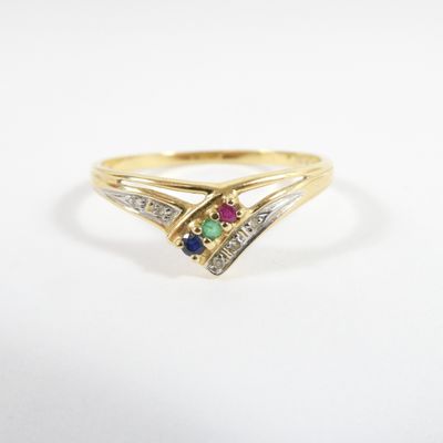 a gold ring with a multi colored stone and diamond accents