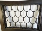 an old iron grill grille on the back of a chair