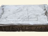 an old book sitting on top of a table covered in dirt