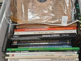 a lot of books in a box on a table