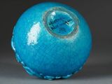 a blue ball with a hole in the middle of it