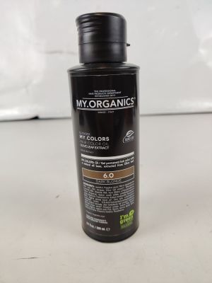 a close up of a bottle of hair color on a table