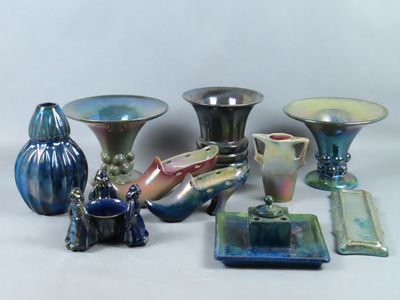 a lot of different vases that are sitting on a table