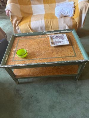 a coffee table with a cup on it in a living room