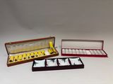 three boxes with different items in them sitting on a white surface