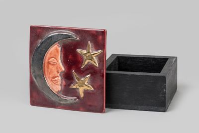 a close up of a box with a moon and stars on it