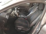 the interior of a car with black leather seats and a steering wheel
