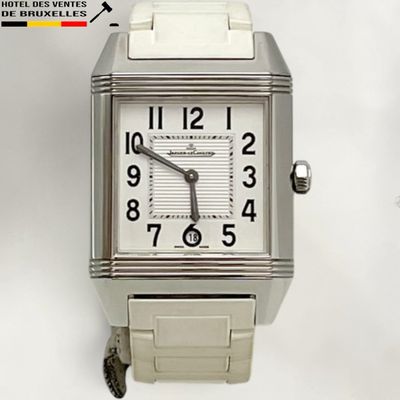 a silver watch with a white face on a white background