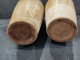 pair of antique chinese bamboo vases on display on a table