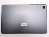 the back of a tablet with a barcode sticker on it