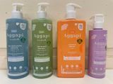 three bottles of aggapi hand soap sitting on a counter