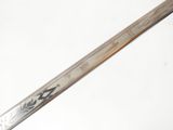 a close up of a sword with a dragon on it