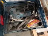 a tool box with tools inside of it on the floor