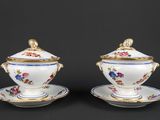 pair of porcelain sugar and creamers with floral decoration