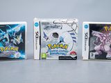 three nintendo wii games are lined up on a table