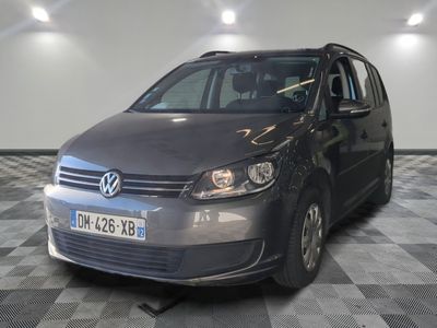 a picture of a grey vw tourer parked in a garage
