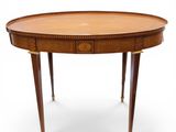 an oval table with two drawers and a drawer on the top