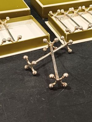 two boxes that have a cross on them on a table
