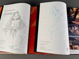 a book with a drawing of a woman in a forest