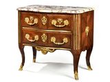 a small chest of drawers with marble top on it