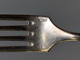 a fork that has been cut in half and is sitting on a table