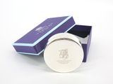 purple gift box with a silver lid and a blue ribbon