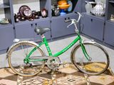 a bike that is sitting on a rug in a room