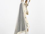an image of a statue of a woman wearing a veil and holding a sword