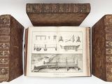 a book opened to show a picture of a boat and other things