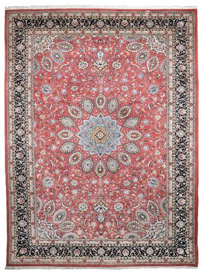 a red and black rug with a floral design