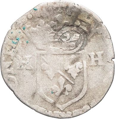 a close up of a coin with a coat of arms on it