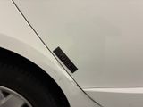 a close up of a car door with a sticker on it