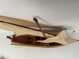 a wooden boat that is hanging on the wall