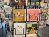 many greeting cards on display in a book store