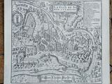 a drawing of a map of a town on a wooden floor
