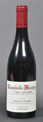a bottle of wine sitting next to a bottle of wine