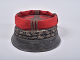 a red hat on top of a black hat