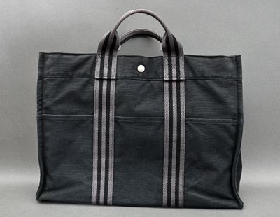 a black tote bag sitting on top of a table