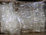 a box full of empty plastic bottles sitting on a table