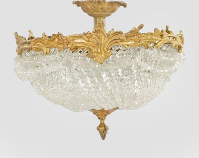 a chandelier made of glass beads hanging from the ceiling