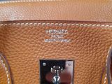 hermes ' s leather handbag with two handles and a metal latch