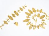 two pairs of gold - plated bracelets and a gold - plated bracelet
