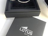 a black box with a pair of bracelets inside of it