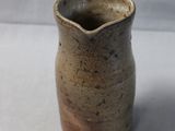 a small vase that is sitting on a table