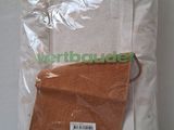 a bag of sand sitting on a table next to a wall