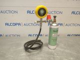 a close up of a gas can and a hose on a table