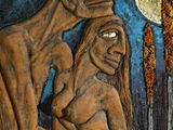 a painting of a man and a woman hugging in front of a full moon